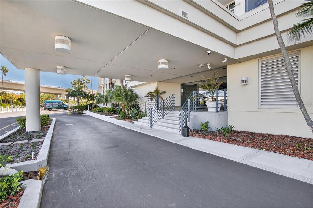 100 Pierce Street, Unit 703 Clearwater, FL 33756 - Photo 51 of 70 a view of a patio with table and chairs and potted plants