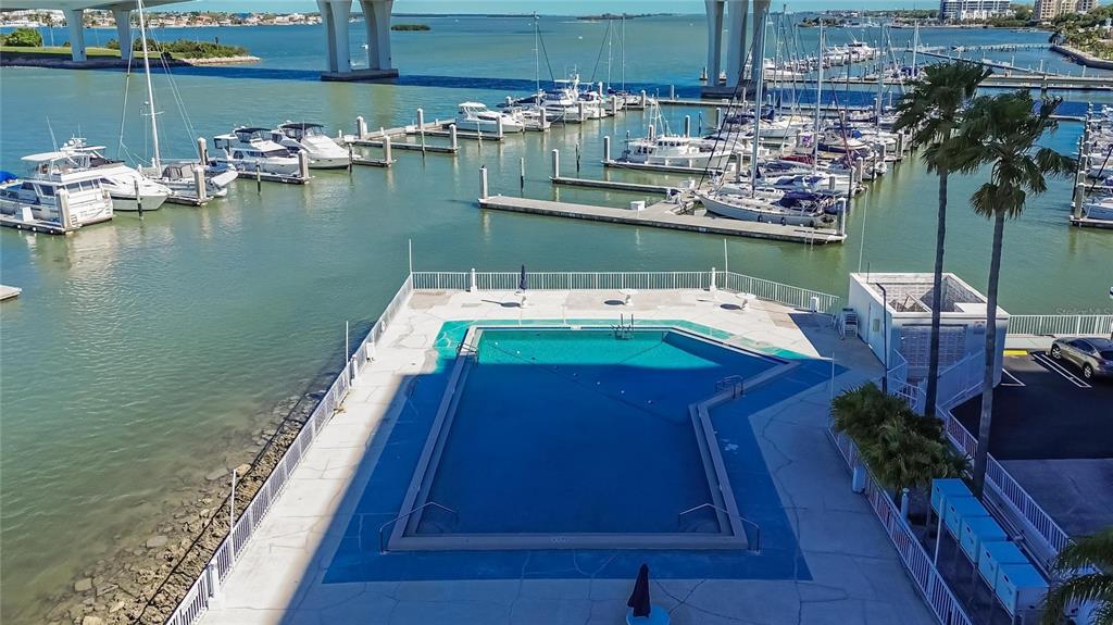 100 Pierce Street, Unit 703 Clearwater, FL 33756 - Photo 66 of 70 a balcony with wooden floor table and chairs