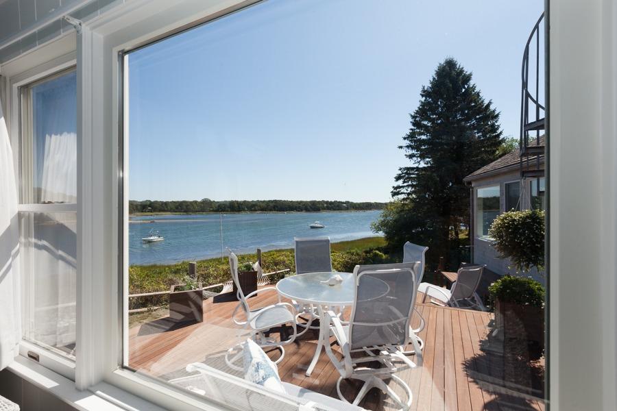 5 Kidd Way Orleans, MA 02653 - Photo 12 of 35 a view of a balcony with lake view and a floor to ceiling window