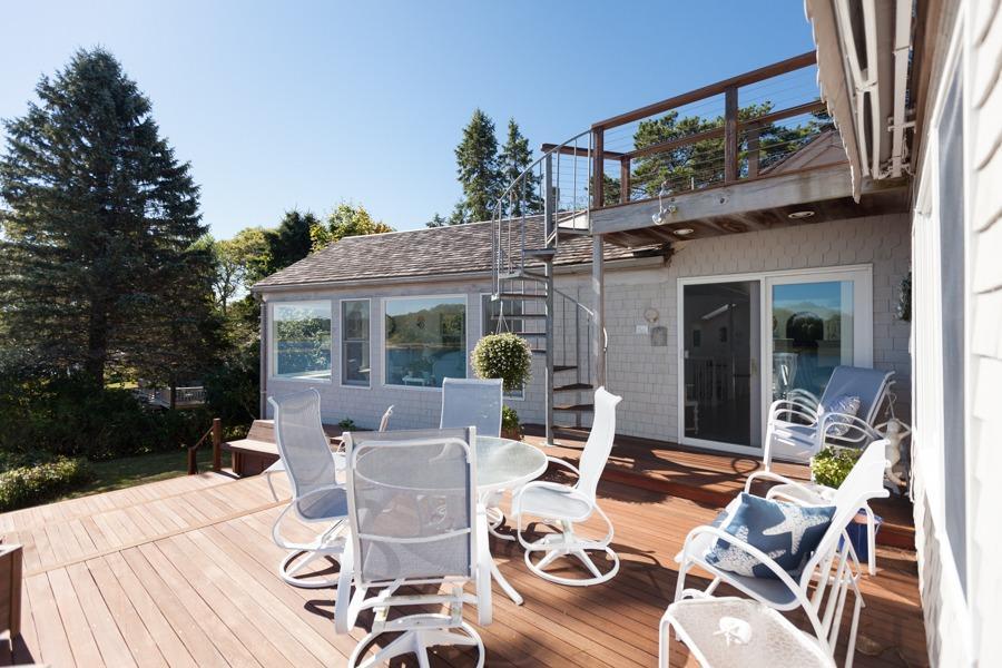 5 Kidd Way Orleans, MA 02653 - Photo 16 of 35 a view of a patio with couches table and chairs and potted plants