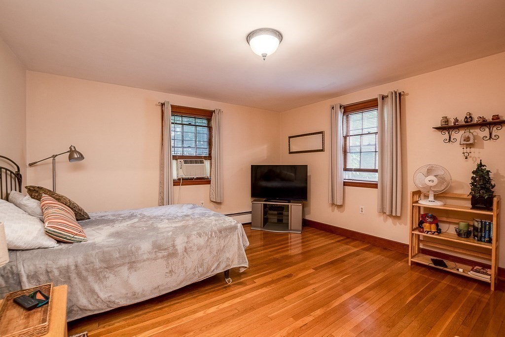8 Franklin Terrace Boston, MA 02136 - Photo 11 of 30 a bedroom with a bed and wooden floor