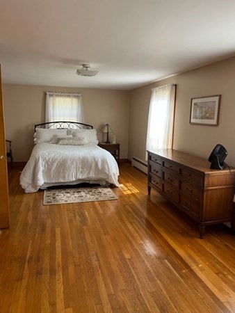 8 Franklin Terrace Boston, MA 02136 - Photo 19 of 30 a spacious bedroom with a bed and wooden floor