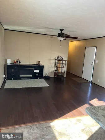 a view of room with window and wooden floor