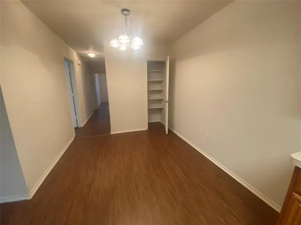 a view of a room with wooden floor and staircase