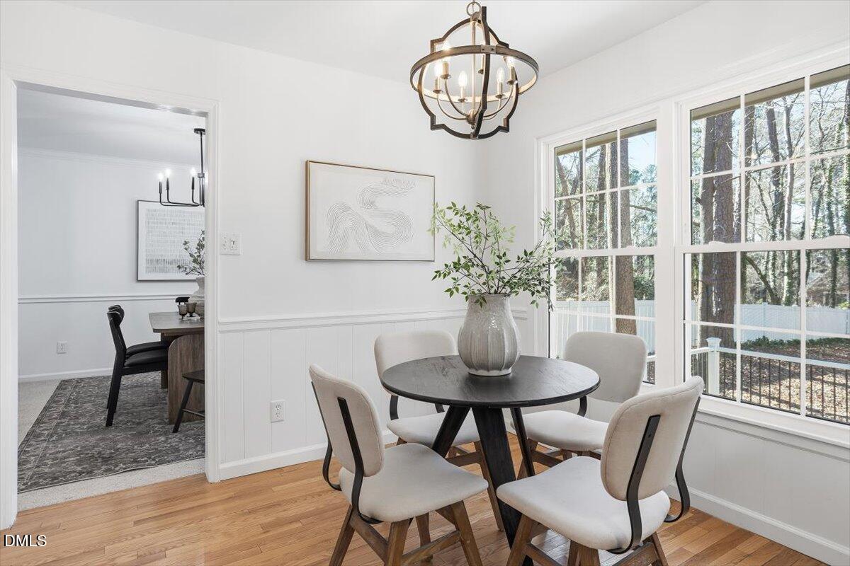 2828 McDowell Road Durham, NC 27705 - Photo 12 of 45 a view of a dining room with furniture window and wooden floor