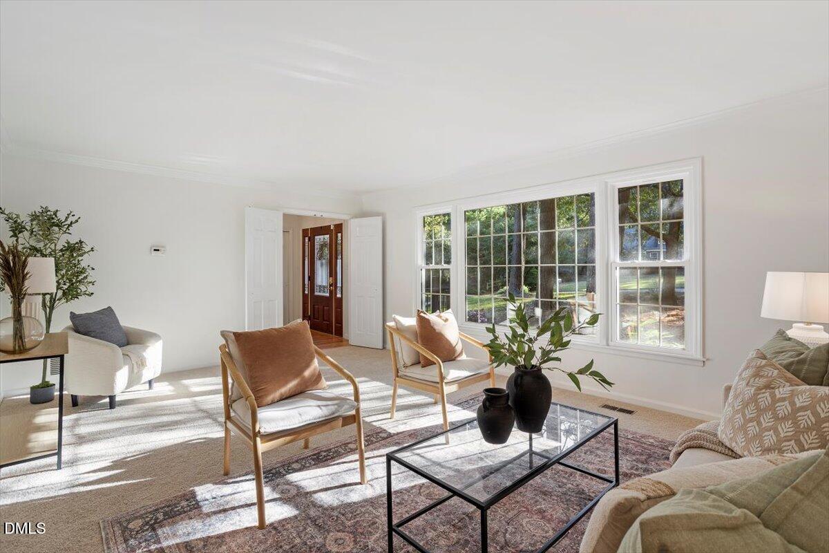 2828 McDowell Road Durham, NC 27705 - Photo 19 of 45 a living room with furniture and floor to ceiling windows