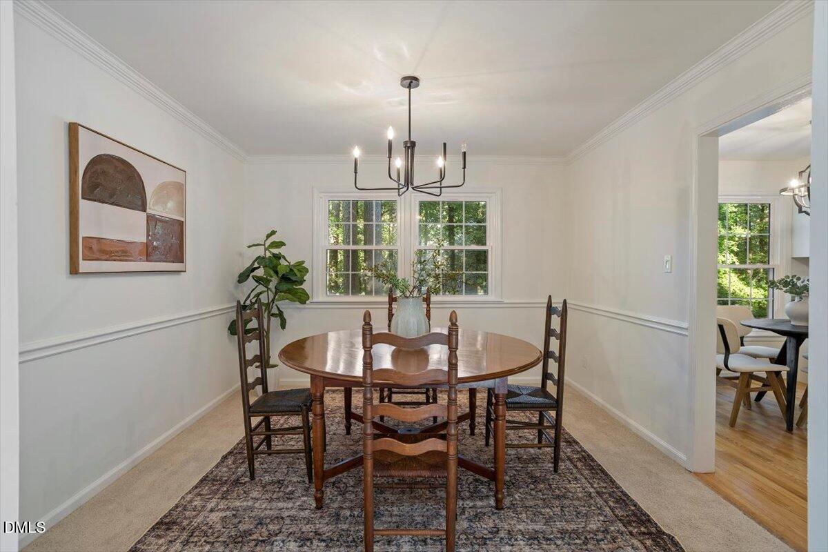 2828 McDowell Road Durham, NC 27705 - Photo 21 of 45 a view of a dining room with furniture window and wooden floor
