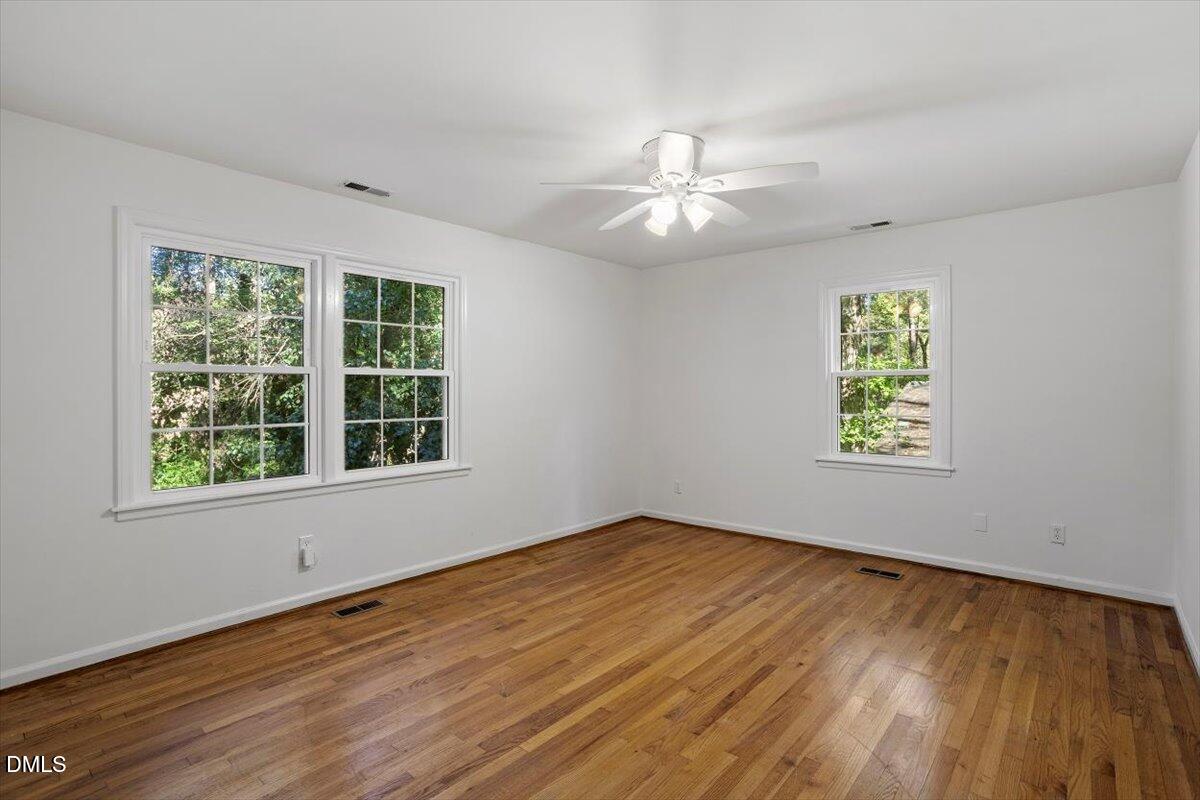 2828 McDowell Road Durham, NC 27705 - Photo 29 of 45 a view of an empty room with wooden floor and a window