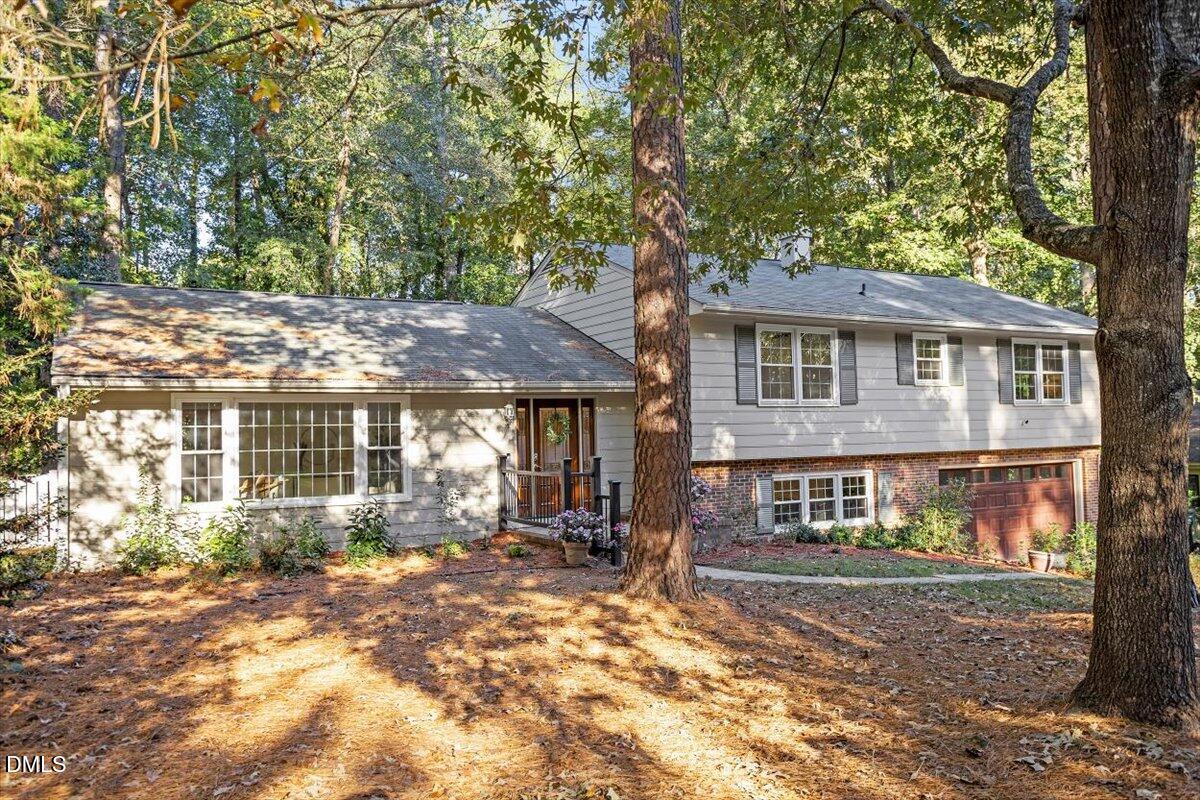 2828 McDowell Road Durham, NC 27705 - Photo 3 of 45 a front view of a house with a yard and a garage