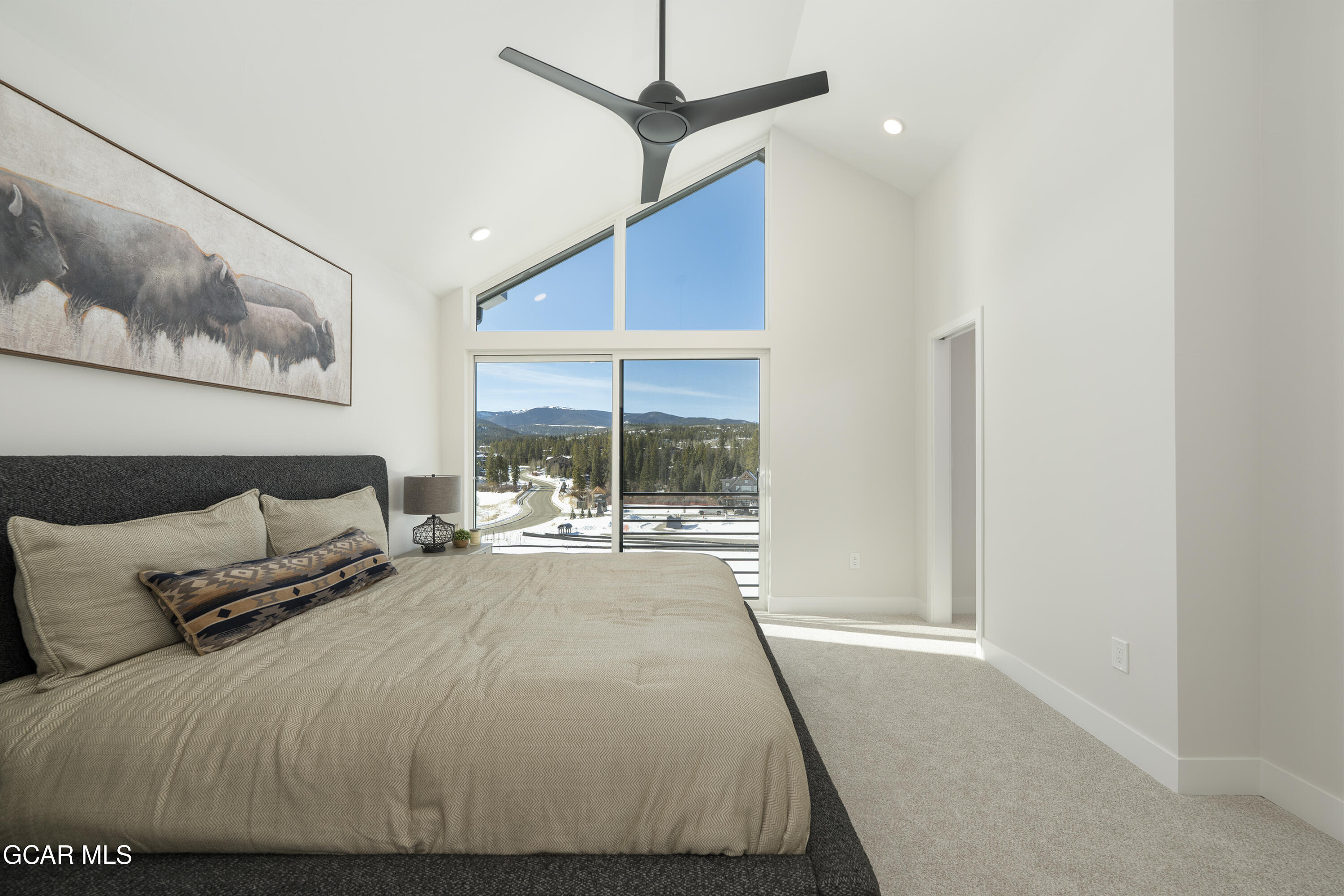30 Wheeler Road Winter Park, CO 80482 - Photo 22 of 42 a bedroom with a large bed and a large window