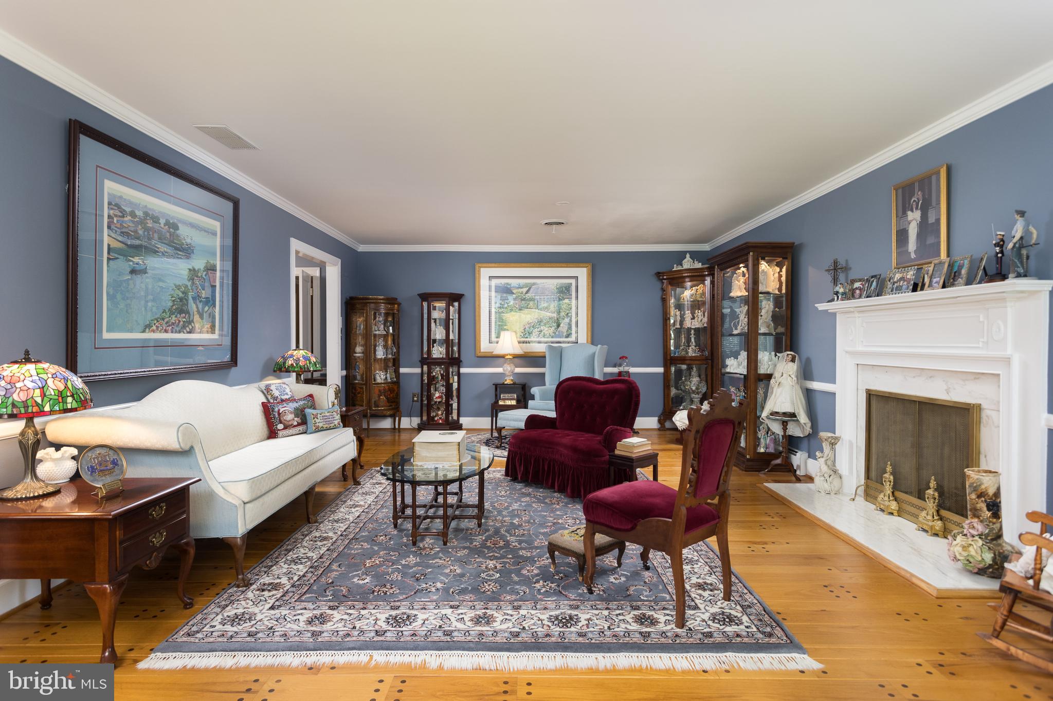 1611 Angleside Road Fallston, MD 21047 - Photo 6 of 37 a living room with furniture a rug and a fireplace