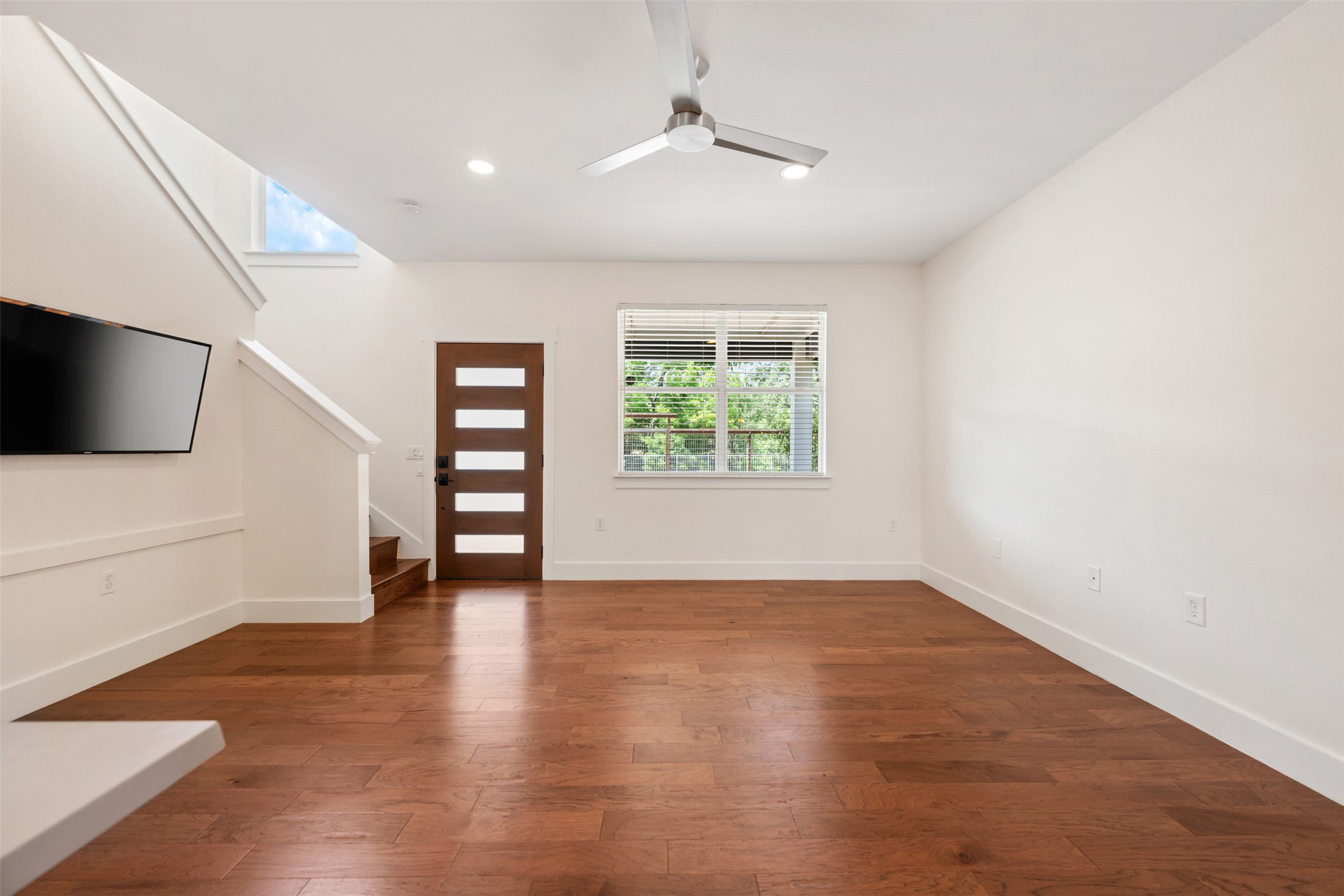 4912 Sara Drive, Unit A Austin, TX 78721 - Photo 7 of 28 Living area with large windows overlooking the park across the street.