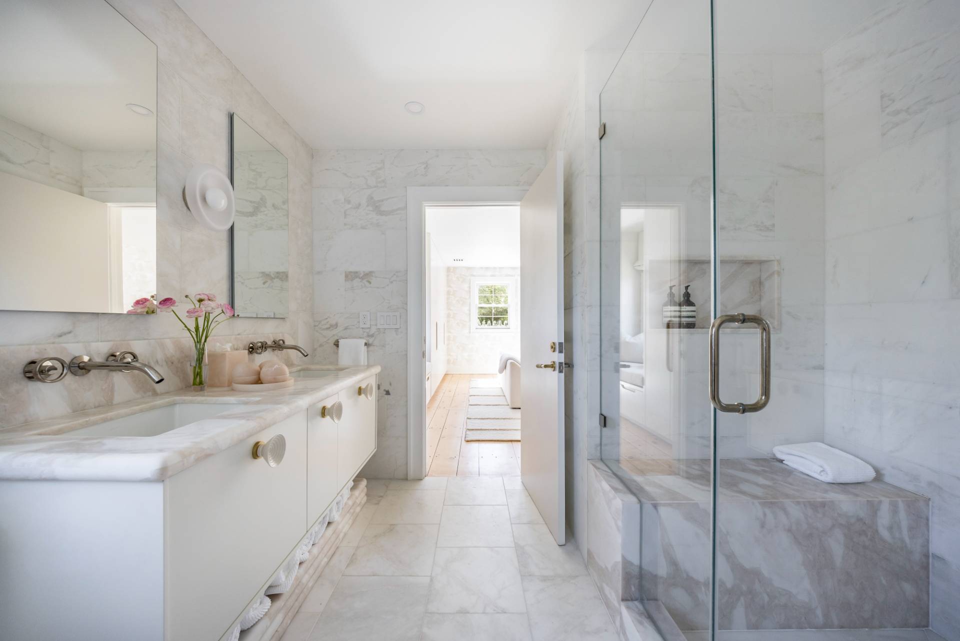 3058 Noyack Road Sag Harbor, NY 11963 - Photo 20 of 34 a bathroom with a double vanity sink mirror and shower