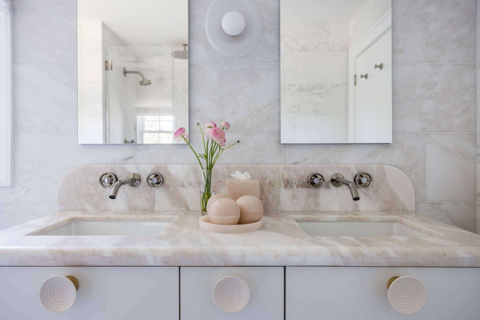3058 Noyack Road Sag Harbor, NY 11963 - Photo 21 of 34 a bathroom with sink and mirror