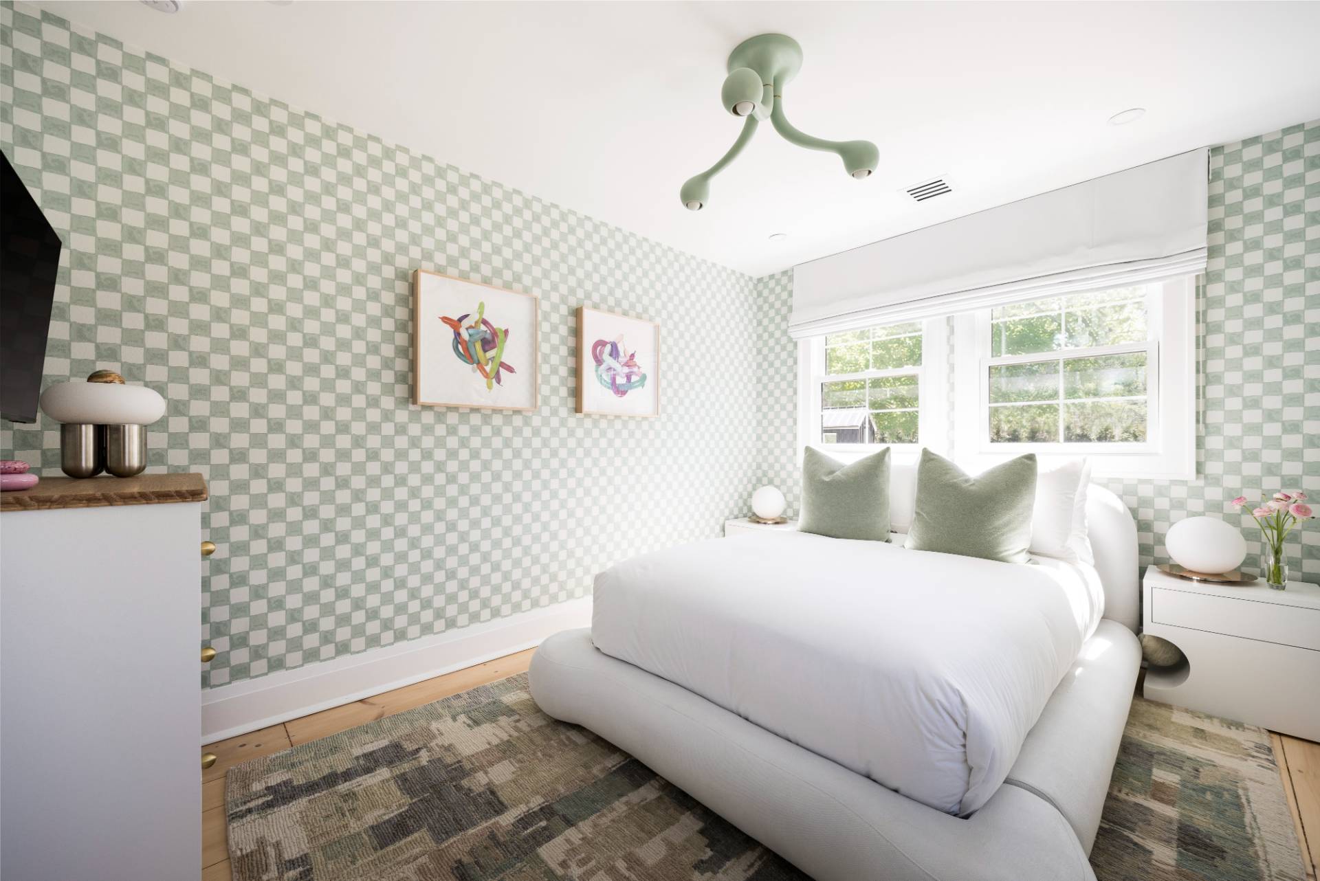 3058 Noyack Road Sag Harbor, NY 11963 - Photo 22 of 34 a bedroom with a bed and a wall painting