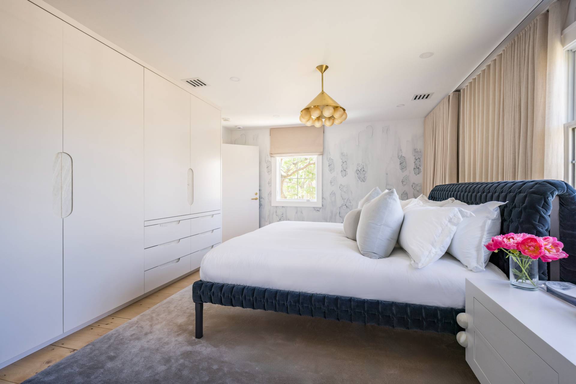 3058 Noyack Road Sag Harbor, NY 11963 - Photo 24 of 34 a bedroom with a bed and window