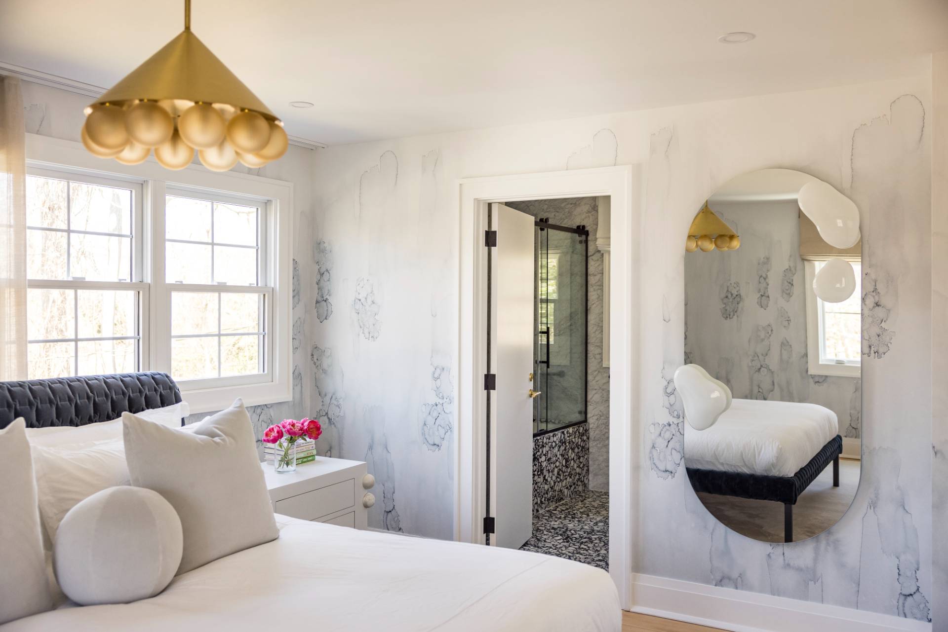 3058 Noyack Road Sag Harbor, NY 11963 - Photo 25 of 34 a bedroom with furniture and a large window