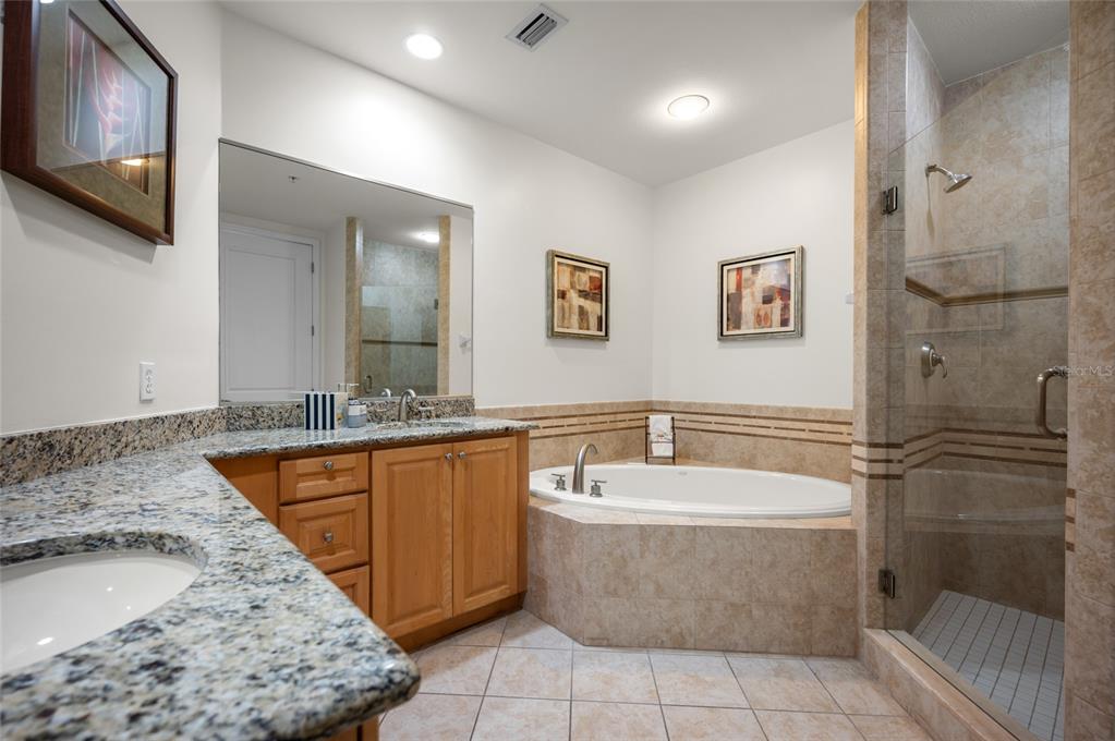 1375 Beach Road, Unit 112 Englewood, FL 34223 - Photo 15 of 50 a bathroom with a tub a sink and a shower