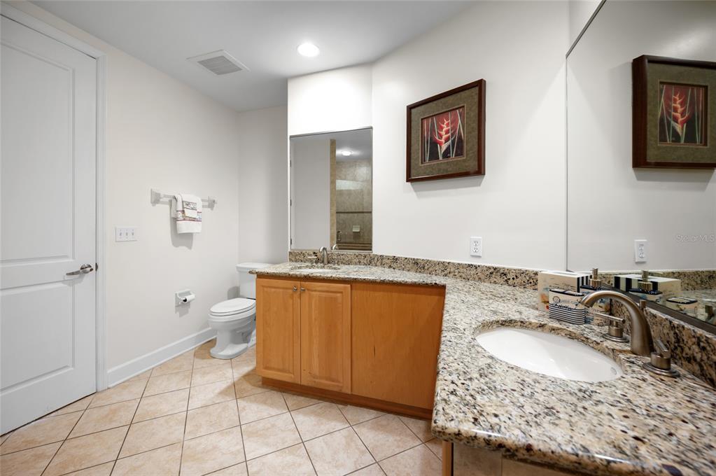 1375 Beach Road, Unit 112 Englewood, FL 34223 - Photo 17 of 50 a bathroom with a granite countertop sink and a mirror