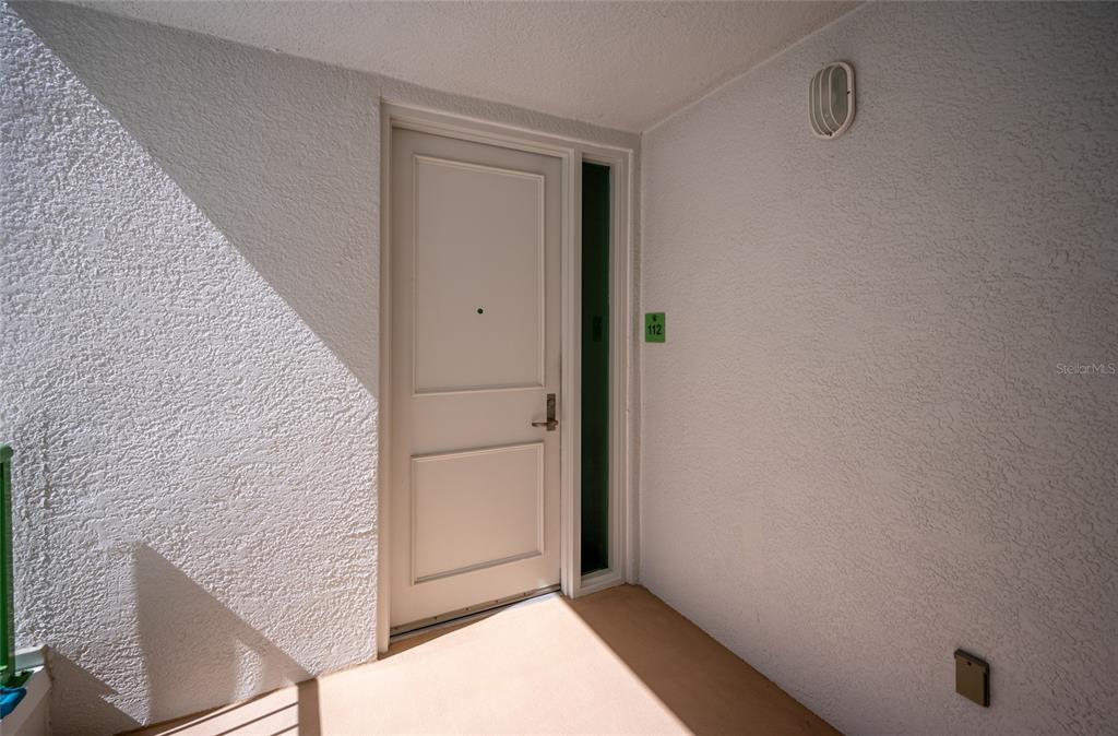 1375 Beach Road, Unit 112 Englewood, FL 34223 - Photo 2 of 50 a view of wooden door