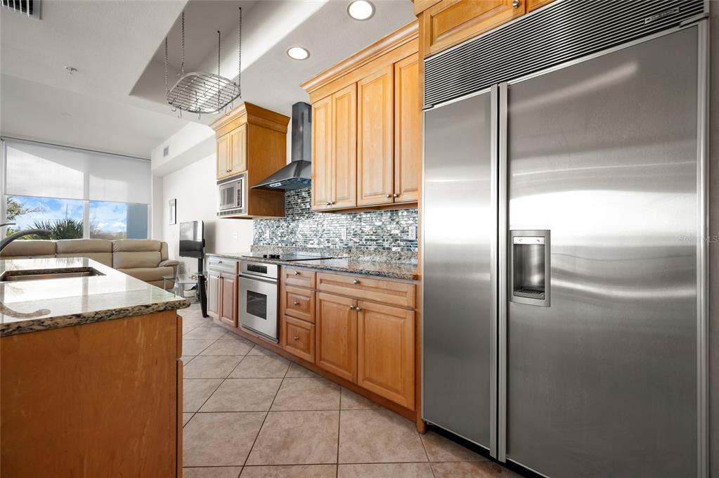 1375 Beach Road, Unit 112 Englewood, FL 34223 - Photo 22 of 50 a kitchen with cabinets and stainless steel appliances