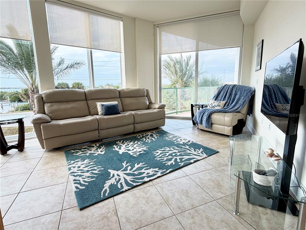 1375 Beach Road, Unit 112 Englewood, FL 34223 - Photo 30 of 50 a living room with furniture and a flat screen tv