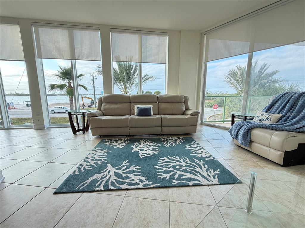 1375 Beach Road, Unit 112 Englewood, FL 34223 - Photo 31 of 50 a living room with furniture and a large window
