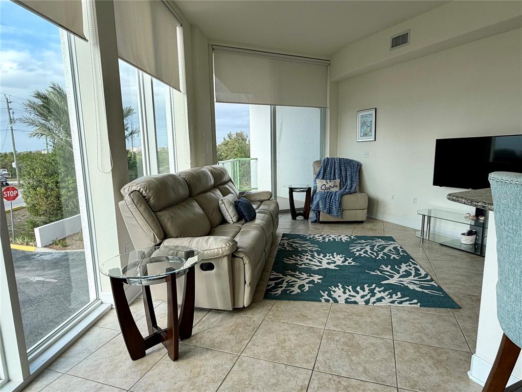 1375 Beach Road, Unit 112 Englewood, FL 34223 - Photo 32 of 50 a living room with furniture and a flat screen tv