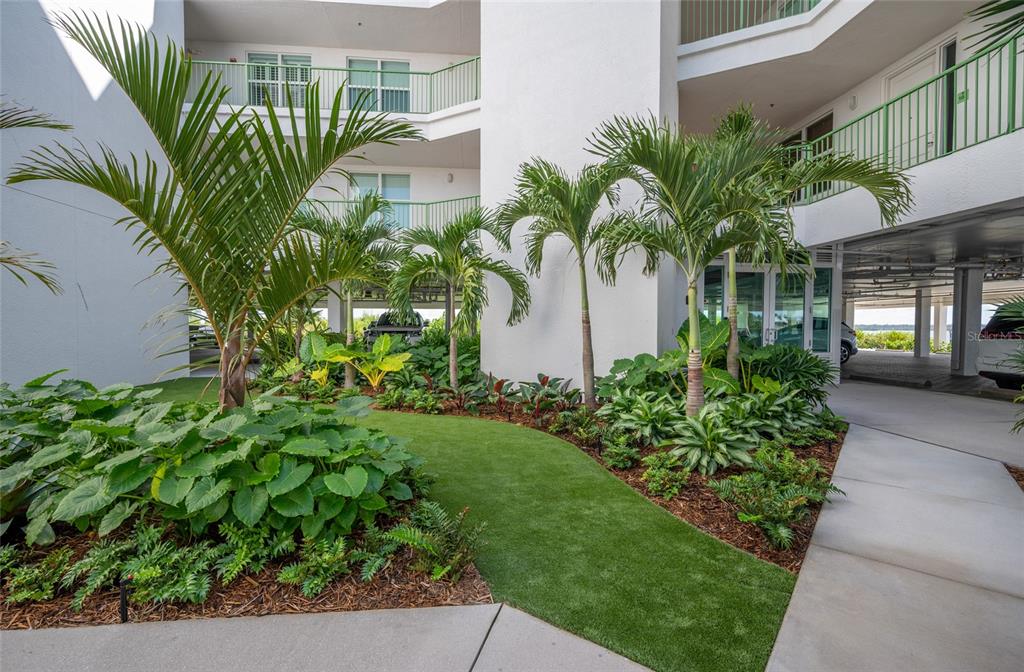 1375 Beach Road, Unit 112 Englewood, FL 34223 - Photo 40 of 50 a plant is in front of building