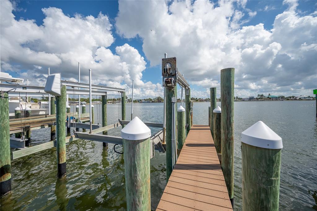 1375 Beach Road, Unit 112 Englewood, FL 34223 - Photo 4 of 50 a view of a lake with a table and chairs