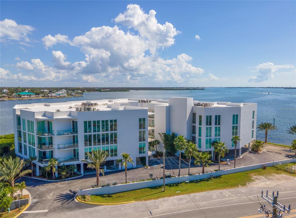 1375 Beach Road, Unit 112 Englewood, FL 34223 - Photo 46 of 50 a view of a swimming pool with outdoor seating