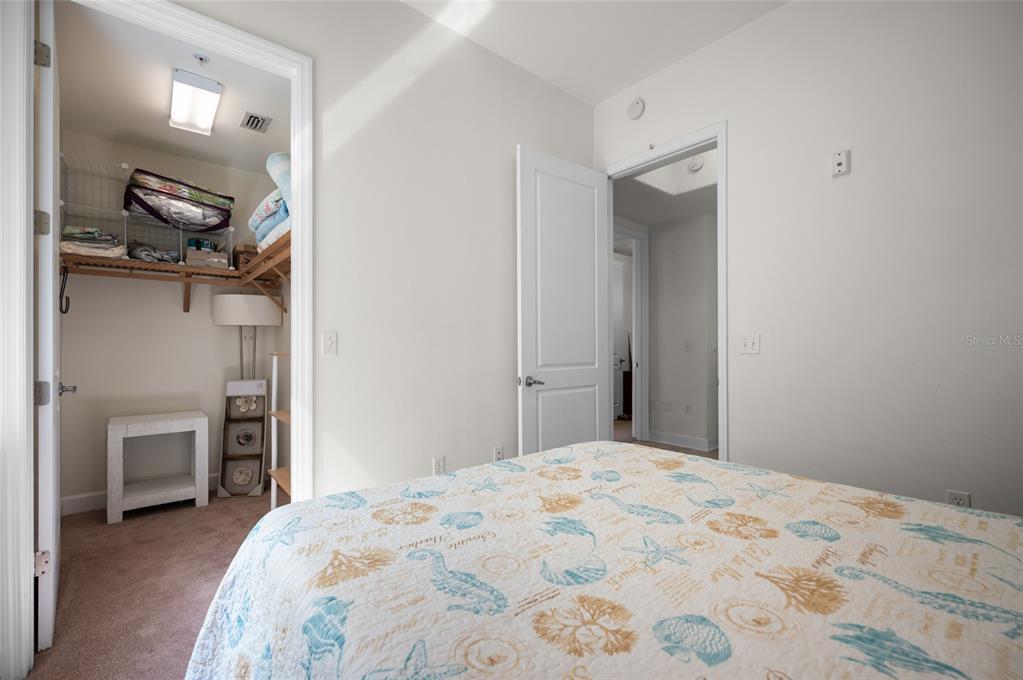 1375 Beach Road, Unit 112 Englewood, FL 34223 - Photo 8 of 50 a bedroom with a bed and a closet