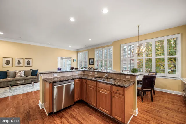 a kitchen with a stove sink and cabinets