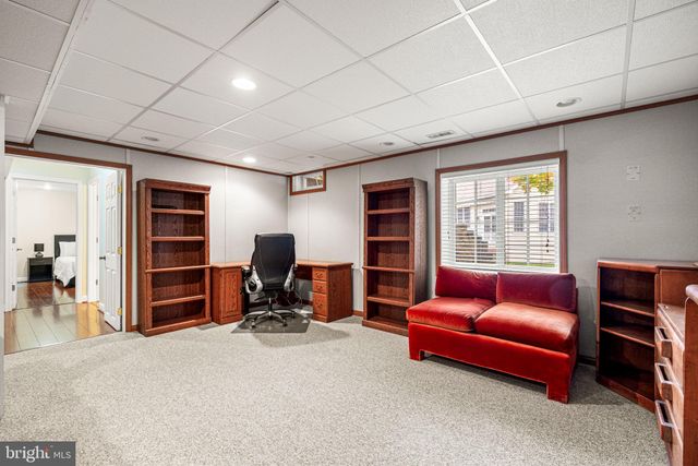 a view of living room with furniture and a window