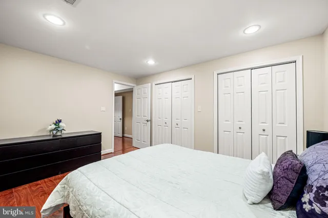 a bedroom with a bed and a dresser