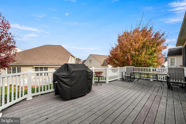 a view of deck with table and chairs and wooden floor