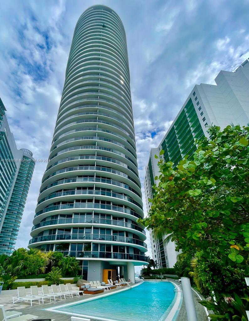 Edgewater Miami, FL 33132 - Photo 22 of 34 a front view of a multi story building with yard