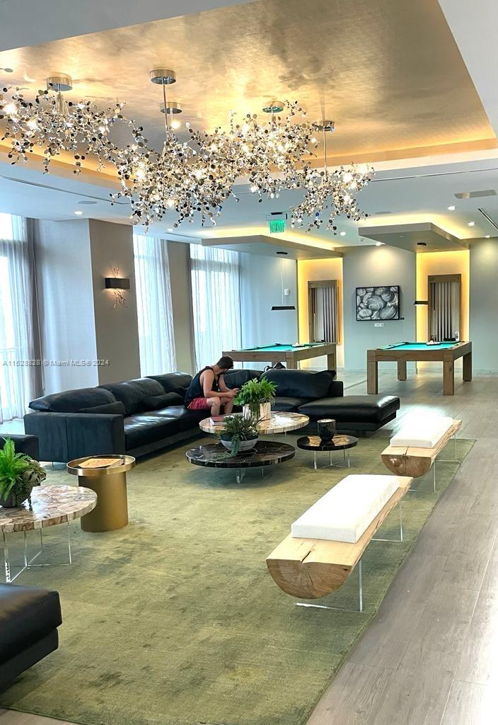 Edgewater Miami, FL 33132 - Photo 27 of 34 a living room with furniture pool table and chairs