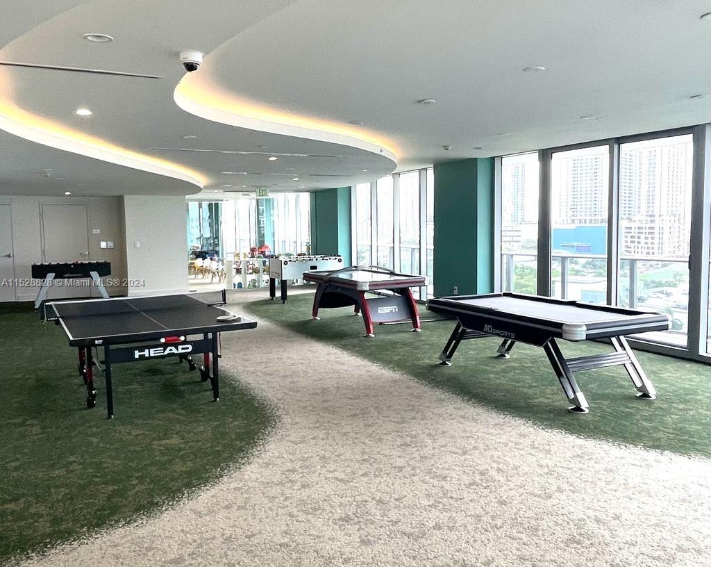 Edgewater Miami, FL 33132 - Photo 30 of 34 a living room with furniture a rug and a large window