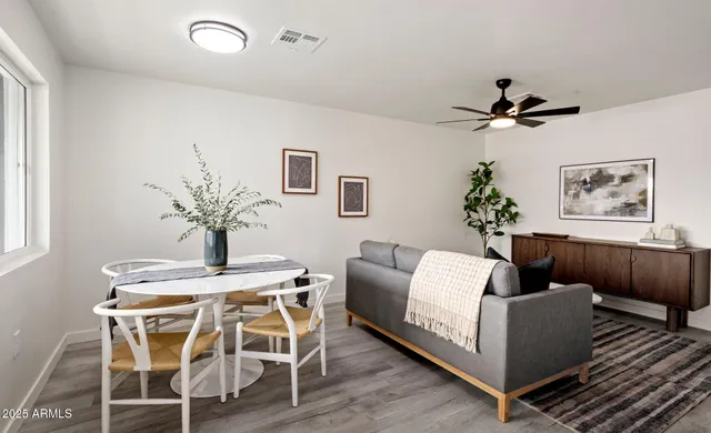 a view of a livingroom with furniture and wooden floor