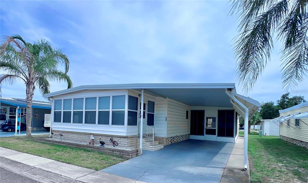 1100 South Belcher Road, Unit 663 Largo, FL 33771 - Photo 1 of 65 a view of house with a yard