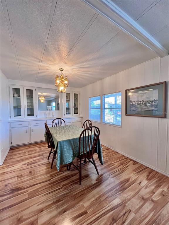 1100 South Belcher Road, Unit 663 Largo, FL 33771 - Photo 11 of 65 a view of a dining room with furniture window and wooden floor