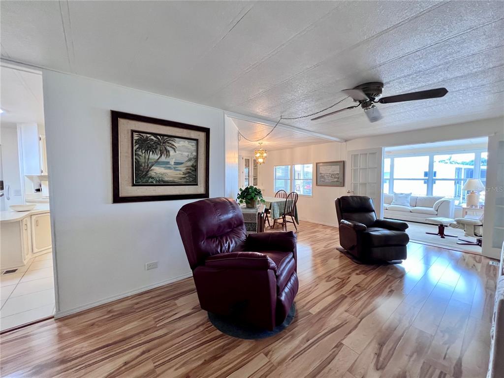 1100 South Belcher Road, Unit 663 Largo, FL 33771 - Photo 18 of 65 a living room with furniture and wooden floor