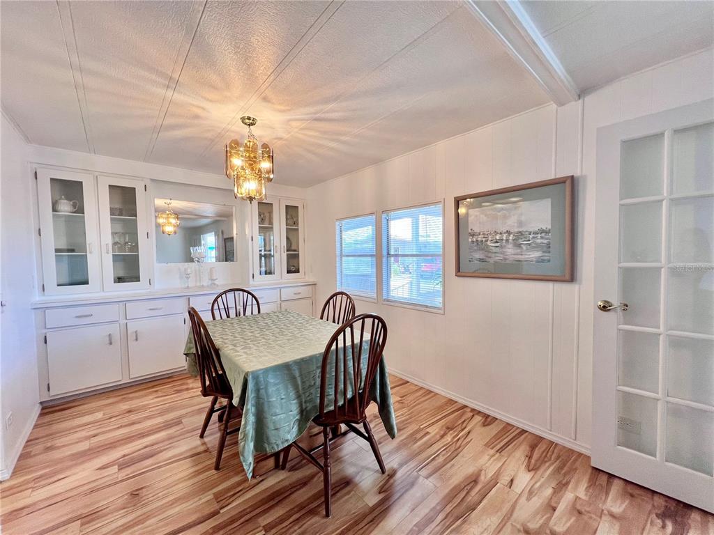 1100 South Belcher Road, Unit 663 Largo, FL 33771 - Photo 19 of 65 a view of a dining room with furniture window and wooden floor