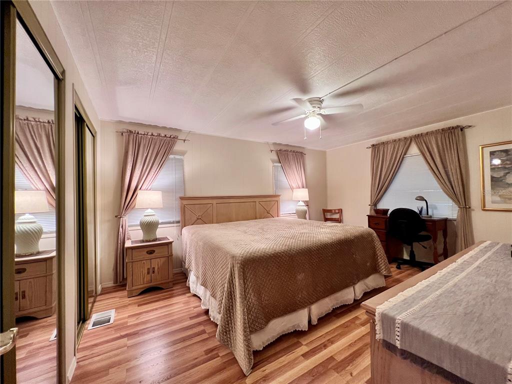 1100 South Belcher Road, Unit 663 Largo, FL 33771 - Photo 23 of 65 a bedroom with a large bed and a window