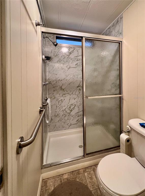 1100 South Belcher Road, Unit 663 Largo, FL 33771 - Photo 27 of 65 a bathroom with a toilet and a shower