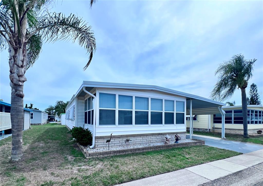 1100 South Belcher Road, Unit 663 Largo, FL 33771 - Photo 3 of 65 a view of house with a yard