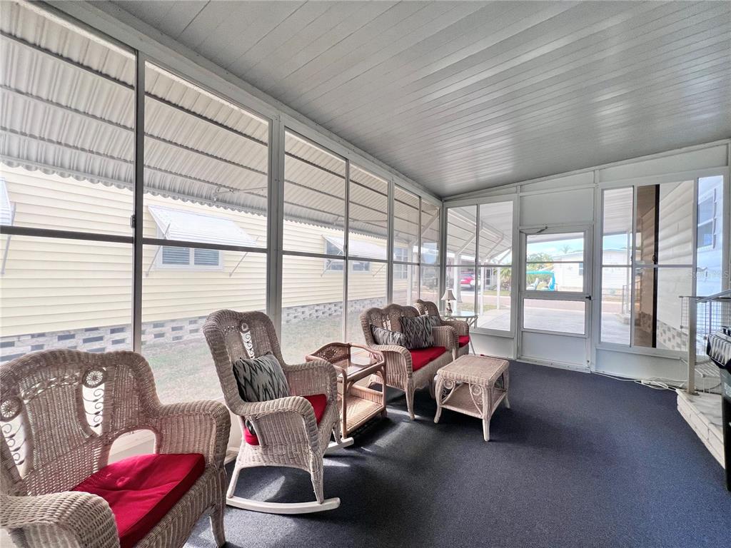 1100 South Belcher Road, Unit 663 Largo, FL 33771 - Photo 31 of 65 a living room with furniture and floor to ceiling windows
