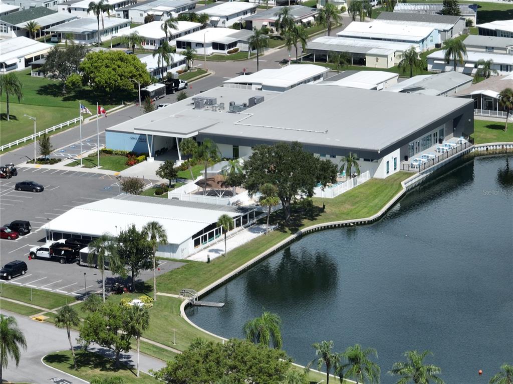 1100 South Belcher Road, Unit 663 Largo, FL 33771 - Photo 38 of 65 an aerial view of a house with a garden and lake view