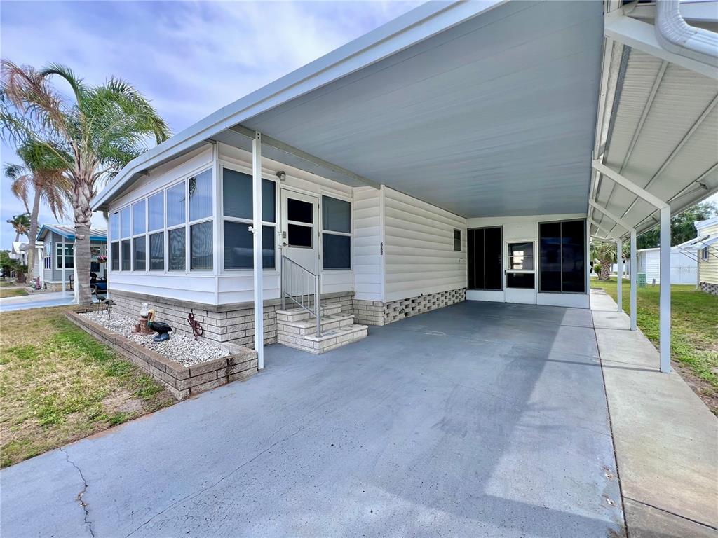 1100 South Belcher Road, Unit 663 Largo, FL 33771 - Photo 4 of 65 front view of a house with a patio